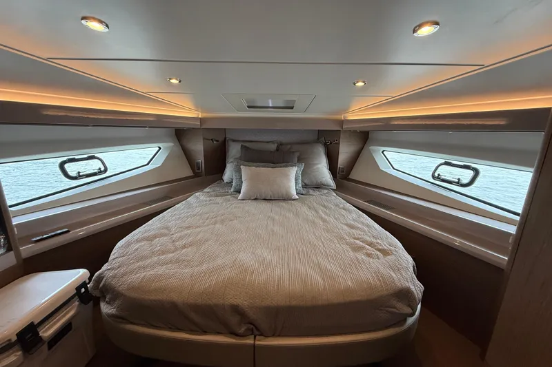 Slide: The Image of Luxurious bedroom interior of 2018 Beneteau Gran Turismo 50 yacht with elegant bedding. - 39