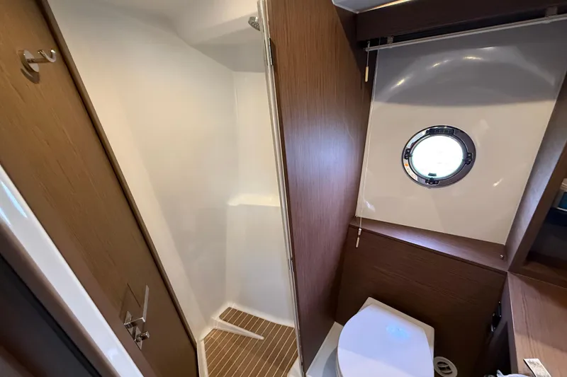 Slide: The Image of Bathroom interior of 2018 Beneteau Gran Turismo 50 yacht with shower and porthole. - 42