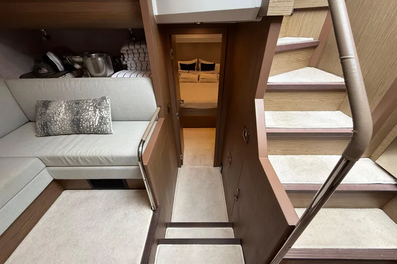 Slide: The Image of Luxurious interior of 2018 Beneteau Gran Turismo 50 yacht with cozy seating and elegant stairs. - 43