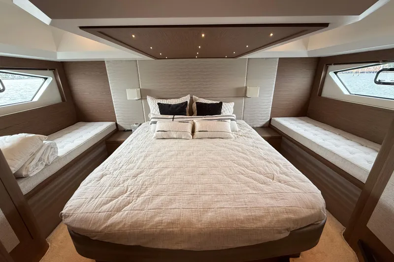 Slide: The Image of Luxurious bedroom interior of 2018 Beneteau Gran Turismo 50 yacht with elegant bedding. - 45