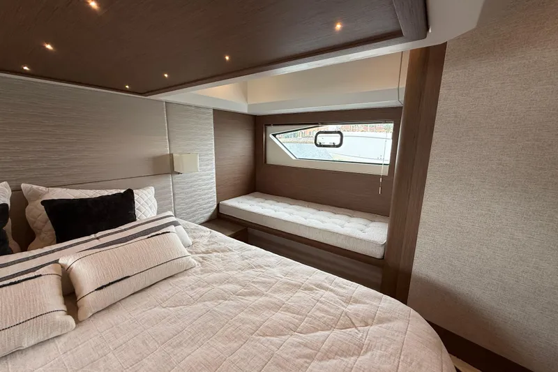 Slide: The Image of Luxurious bedroom interior of 2018 Beneteau Gran Turismo 50 yacht with elegant bedding. - 47