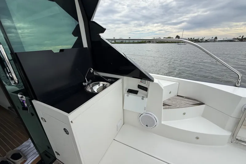 Slide: The Image of 2018 Beneteau Gran Turismo 50 yacht with outdoor sink and scenic water view. - 59