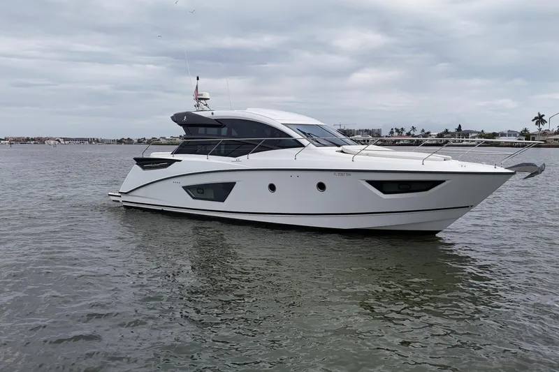Slide: The Image of 2018 Beneteau Gran Turismo 50 yacht cruising on calm waters under cloudy skies. - 6