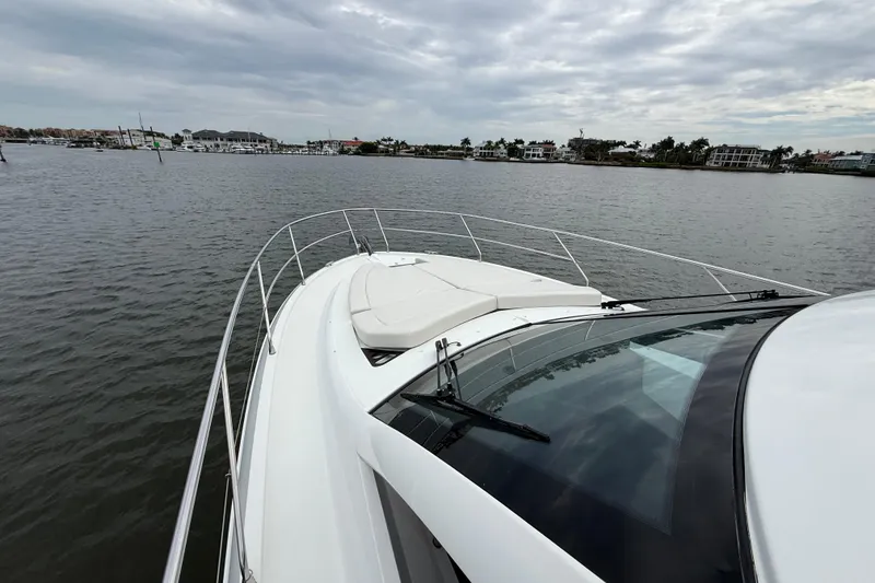 Slide: The Image of 2018 Beneteau Gran Turismo 50 yacht on calm waters under cloudy skies. - 66