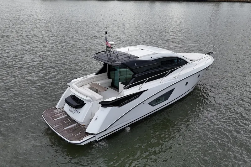 Slide: The Image of 2018 Beneteau Gran Turismo 50 yacht on calm water, rear view. - 9