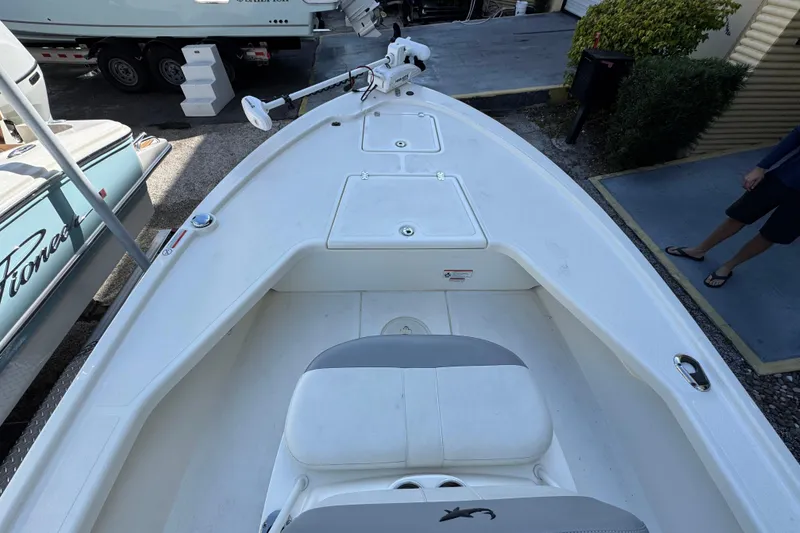 Slide: The Image of 2023 Mako 18 LTS boat interior with seating and storage compartments. - 10