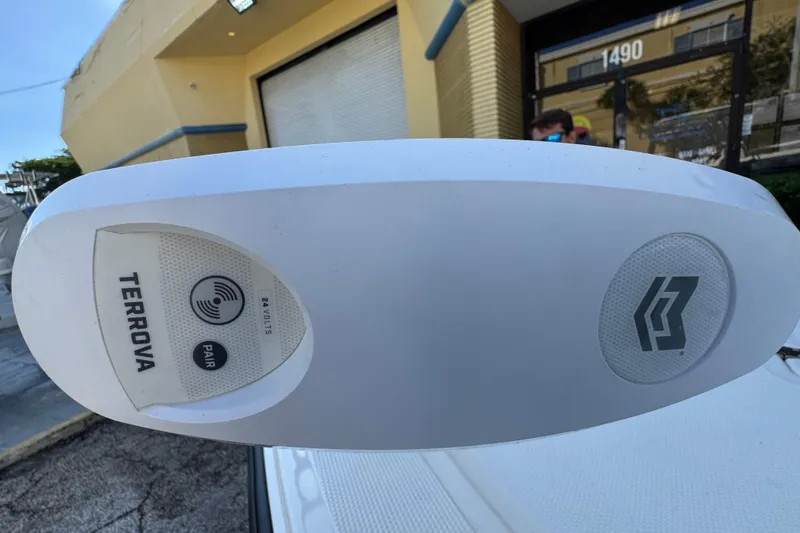 Slide: The Image of 2023 Mako 18 LTS boat with Terrova trolling motor, outdoor setting. - 19