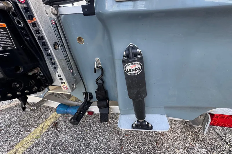 Slide: The Image of 2023 Mako 18 LTS boat with Lenco trim tab and Outboard bracket. - 7