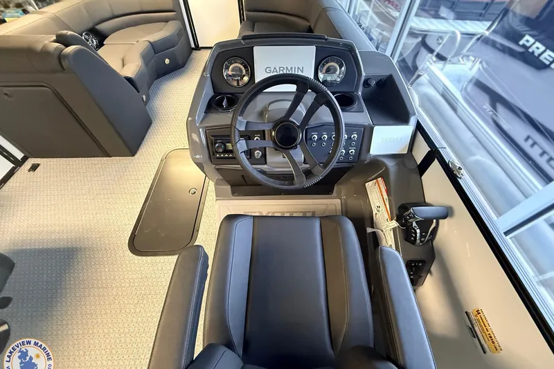 Slide: The Image of 2026 Evotti 523CS boat interior with Garmin navigation and Yamaha controls. - 10