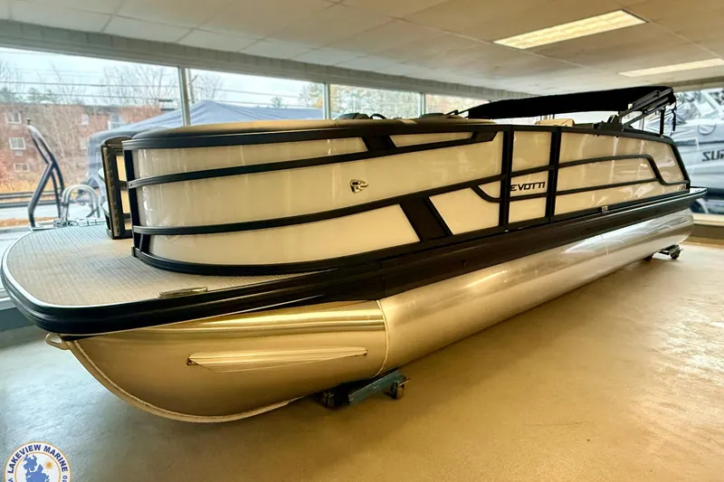 Slide: The Image of 2026 Evotti 523CS pontoon boat displayed indoors, featuring sleek design and modern aesthetics. - 19