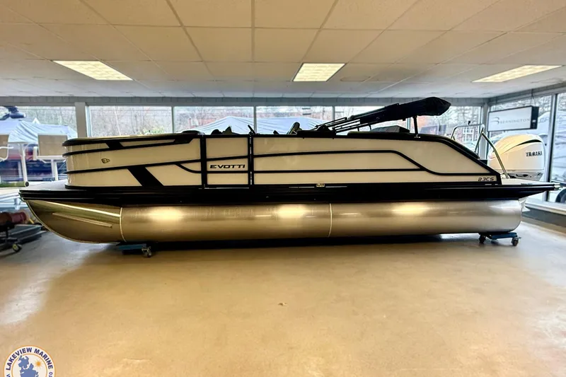 Slide: The Image of 2026 Evotti 523CS pontoon boat displayed indoors, showcasing sleek design and modern features. - 20