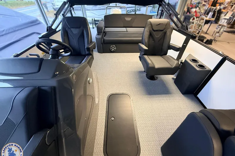 Slide: The Image of Interior of 2026 Evotti 523CS boat with modern seating and steering wheel. - 9