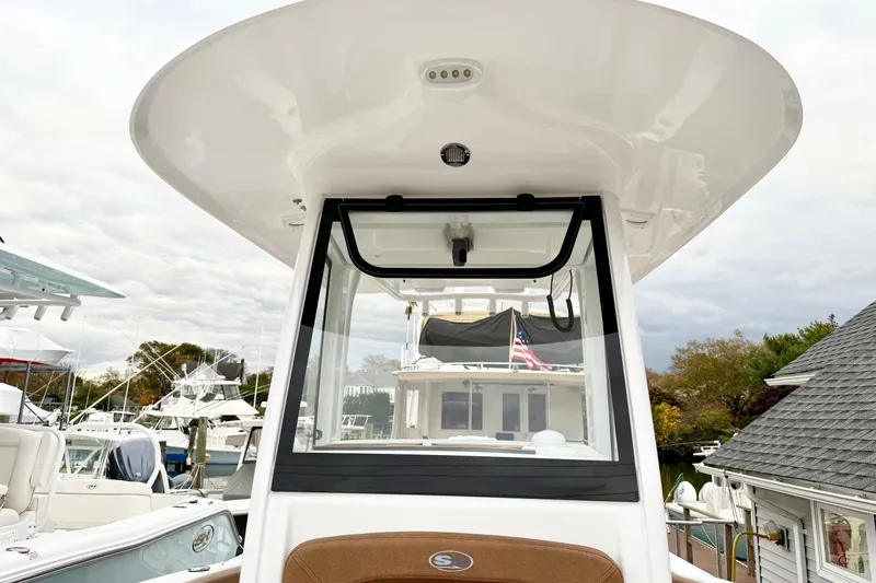 Slide: The Image of 2026 Sea Hunt Ultra 245 SE boat with sleek design and modern features. - 12