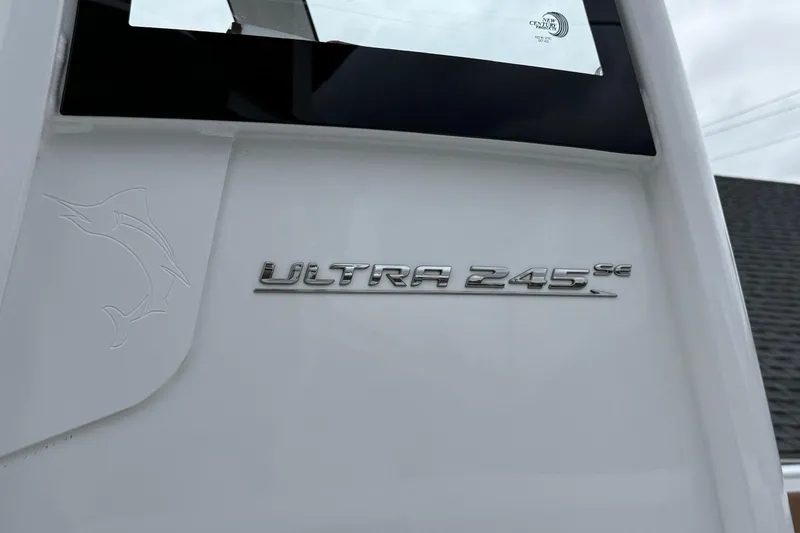 Slide: The Image of 2026 Sea Hunt Ultra 245 SE boat emblem on white surface. - 9