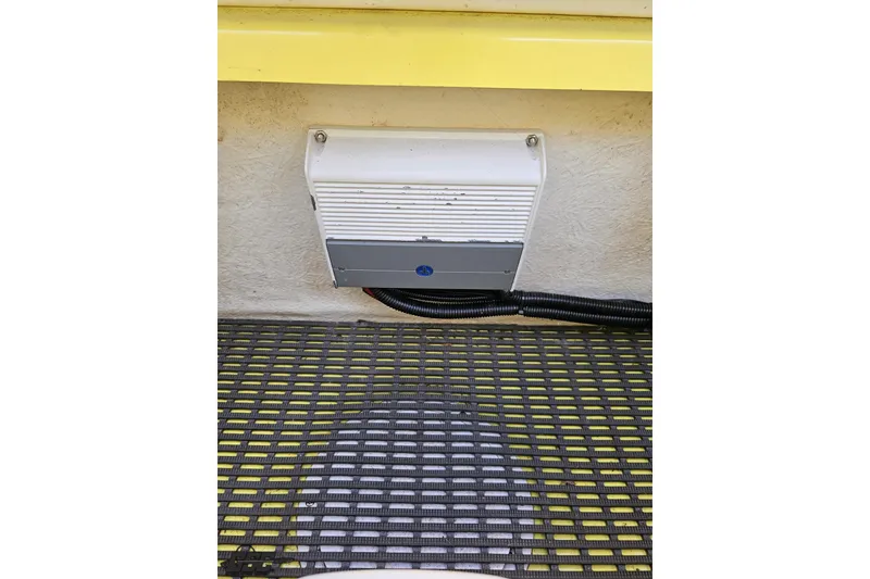 Slide: The Image of 2005 Baja 25 Outlaw boat interior with electronic component and wiring. - 105