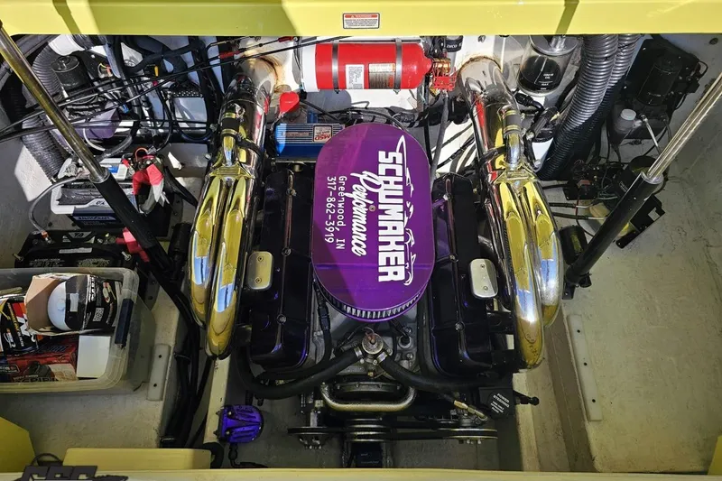 Slide: The Image of Engine compartment of a 2005 Baja 25 Outlaw boat with custom modifications. - 111