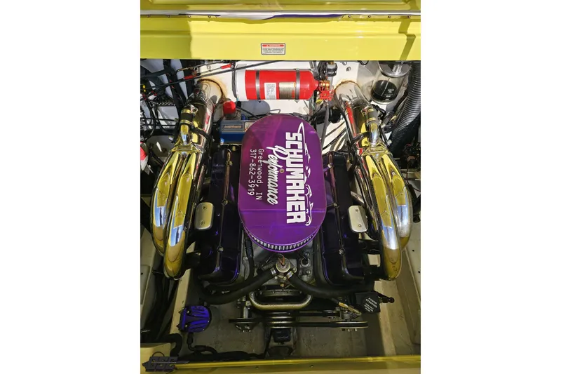 Slide: The Image of 2005 Baja 25 Outlaw engine with Schumacher performance enhancements, featuring chrome components and fire extinguisher. - 113