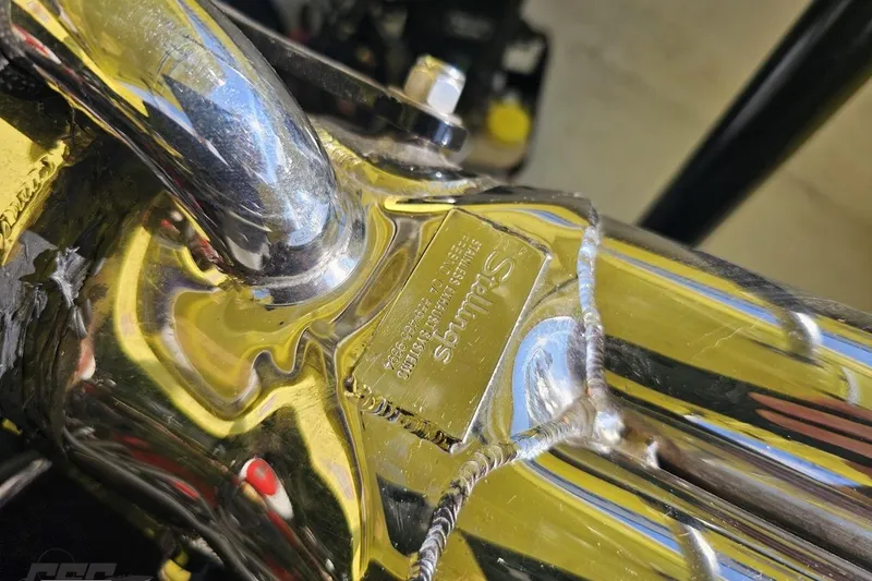 Slide: The Image of Close-up of a polished metal component on a 2005 Baja 25 Outlaw boat. - 116