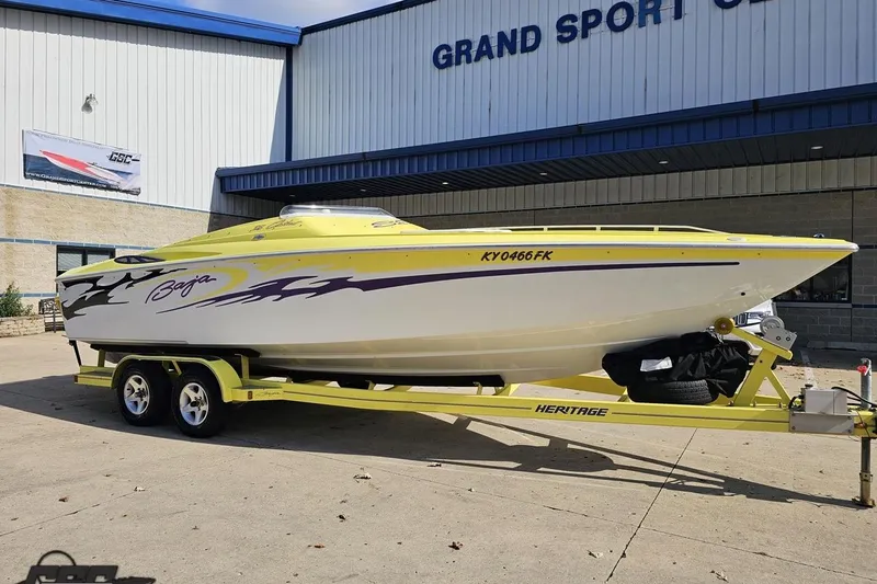Slide: The Image of 2005 Baja 25 Outlaw boat on trailer outside Grand Sport Center. - 18