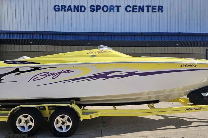 Slide: The Image of 2005 Baja 25 Outlaw speedboat in yellow and white at Grand Sport Center. - 3