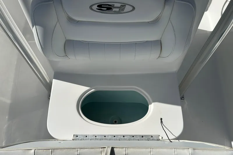Slide: The Image of 2016 Sea Hunt Triton 225 boat interior with livewell and seating. - 17