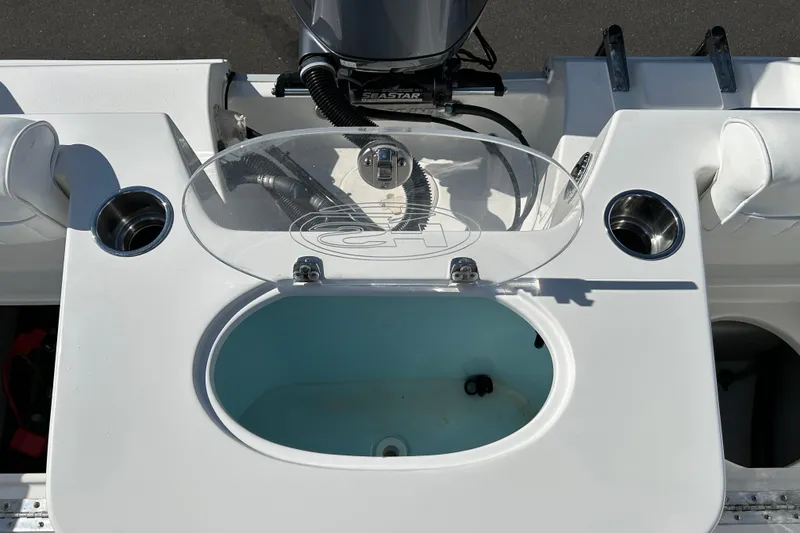 Slide: The Image of 2016 Sea Hunt Triton 225 boat with livewell and cup holders on deck. - 19