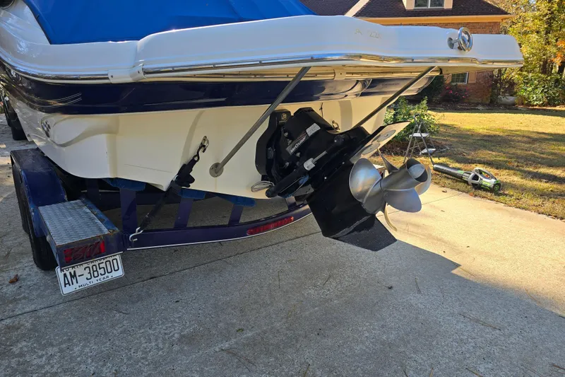 Slide: The Image of Rear view of a 2006 Azure AZ 220 boat on a trailer in a driveway. - 10