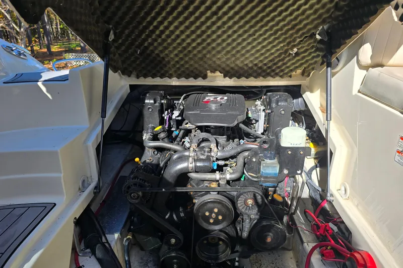 Slide: The Image of Engine compartment of a 2006 Azure AZ 220 boat, showcasing detailed mechanical components. - 13