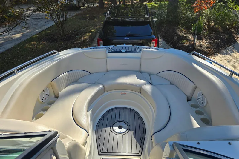 Slide: The Image of Luxurious seating area on a 2006 Azure AZ 220 boat, featuring plush white upholstery. - 16