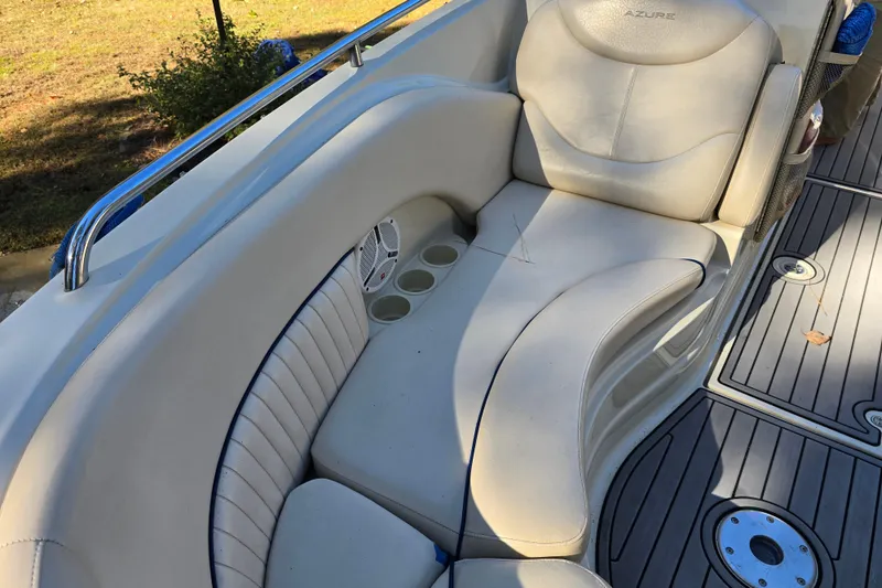 Slide: The Image of Luxurious seating on a 2006 Azure AZ 220 boat with cup holders and speaker. - 18