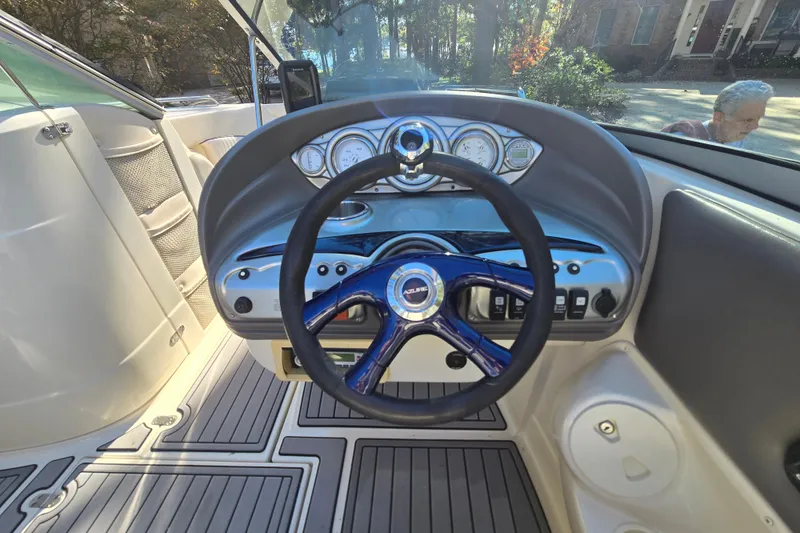 Slide: The Image of Interior view of 2006 Azure AZ 220 boat dashboard with steering wheel and gauges. - 19