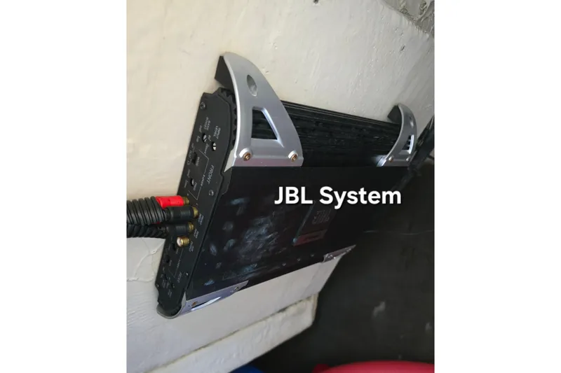 Slide: The Image of Car audio amplifier mounted on wall, featuring JBL system, Azure AZ 220, 2006 model. - 20