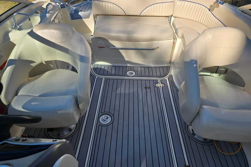 Slide: The Image of Interior of a 2006 Azure AZ 220 boat with white seating and gray flooring. - 28