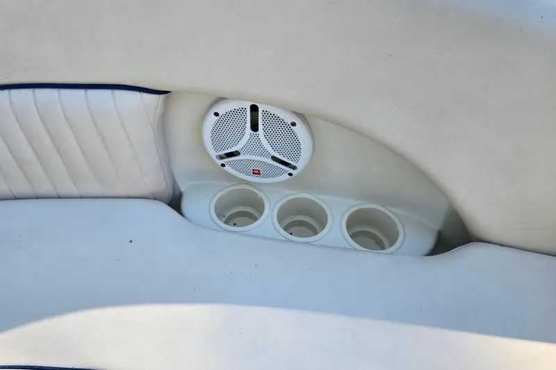 Slide: The Image of 2006 Azure AZ 220 boat interior with speaker and cup holders. - 29