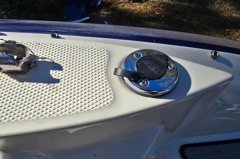 Slide: The Image of Fuel cap on 2006 Azure AZ 220 boat deck, featuring textured surface and chrome finish. - 30