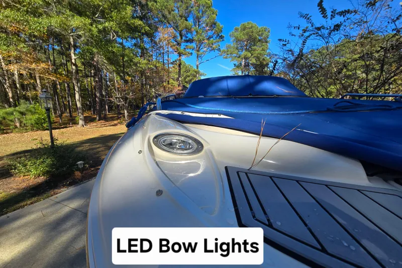 Slide: The Image of Azure AZ 220 boat with LED bow lights, parked in a wooded area. - 33