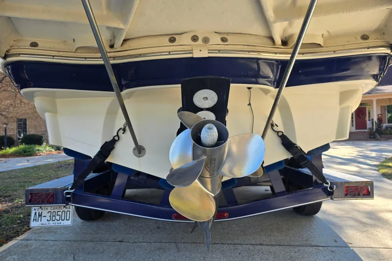 Slide: The Image of Rear view of 2006 Azure AZ 220 boat with propeller and North Carolina license plate. - 9