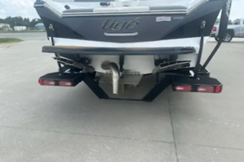 Slide: The Image of Rear view of a 2020 Tigé R23 boat on a trailer. - 12
