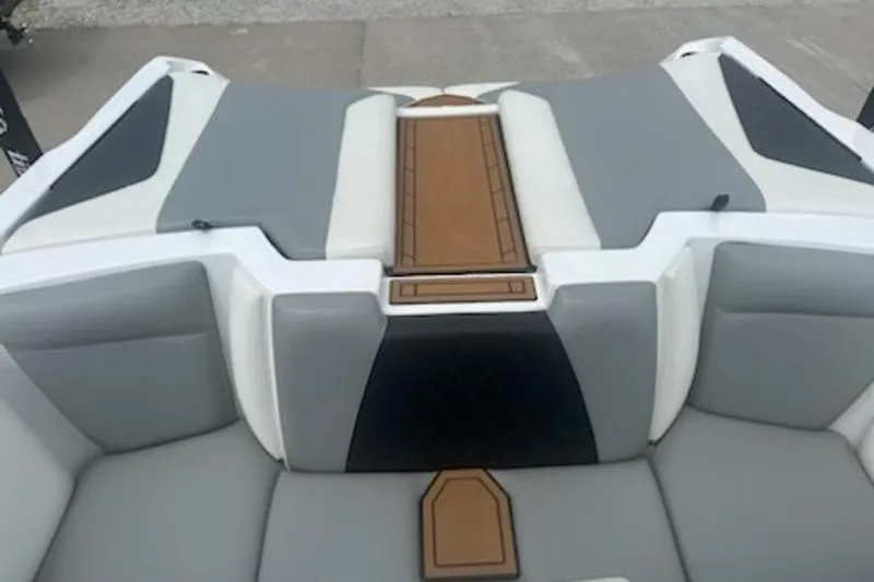 Slide: The Image of 2020 Tigé R23 boat interior with gray and white seating, brown accents. - 3