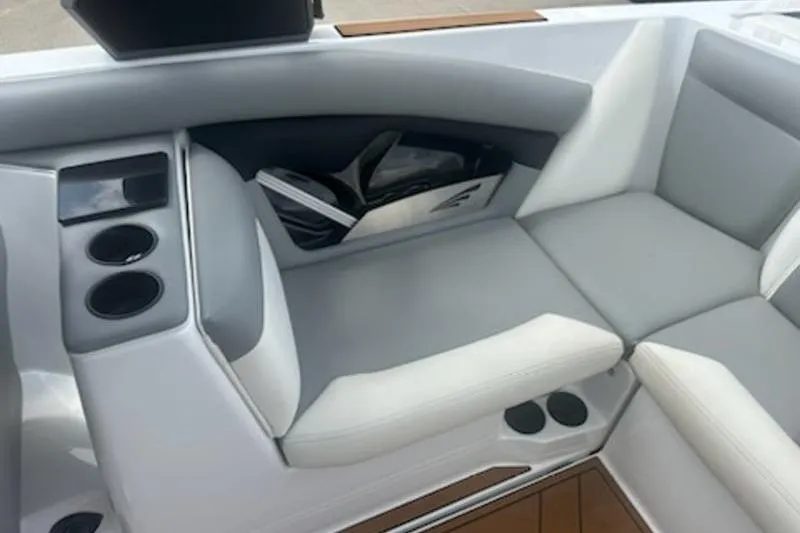 Slide: The Image of 2020 Tigé R23 boat interior with gray seating and cup holders. - 4