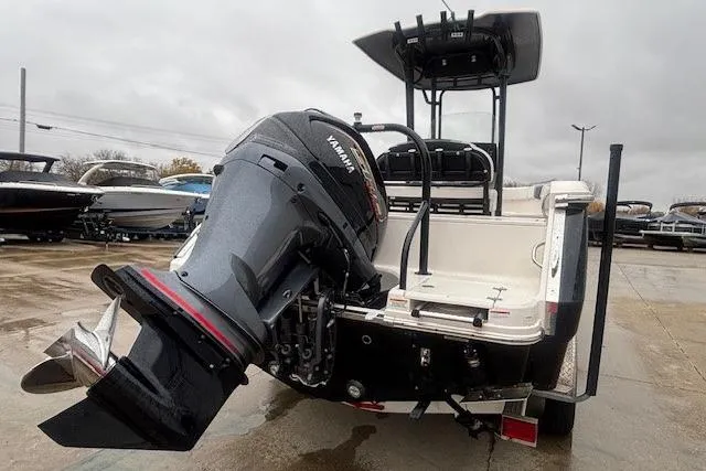 Slide: The Image of 2021 Robalo R230 Center Console boat interior with white cushioned seating. - 13