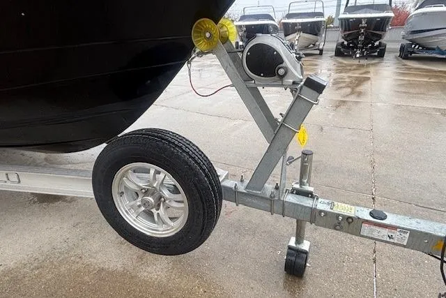 Slide: The Image of 2021 Robalo R230 Center Console boat with Yamaha outboard motor, parked on trailer. - 14