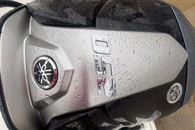 Slide: The Image of Trailer hitch of 2021 Robalo R230 Center Console boat in a parking lot. - 15