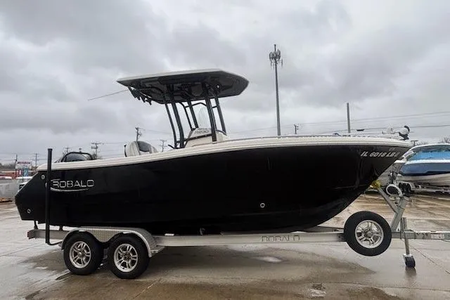 Slide: The Image of 2021 Robalo R230 Center Console boat interior with seating and storage compartments. - 17