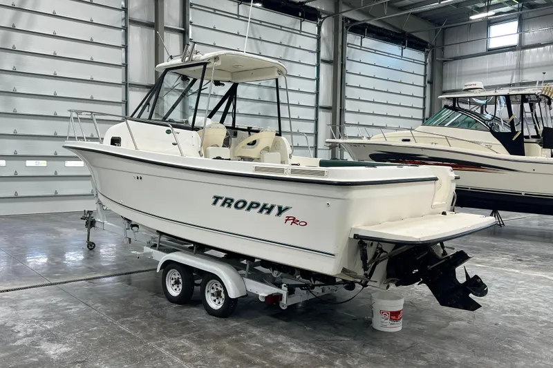Slide: The Image of 2006 Trophy 2352 WA boat on trailer in indoor storage facility. - 1