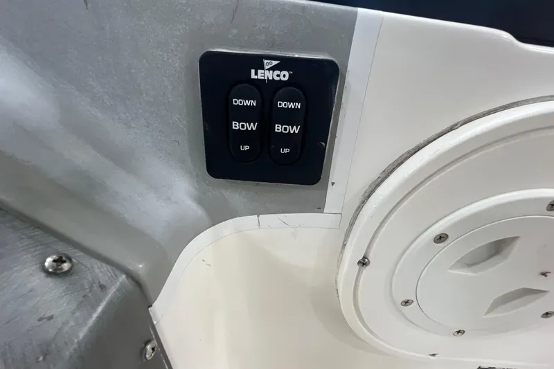 Slide: The Image of Lenco trim tab control on 2006 Trophy 2352 WA boat dashboard. - 12