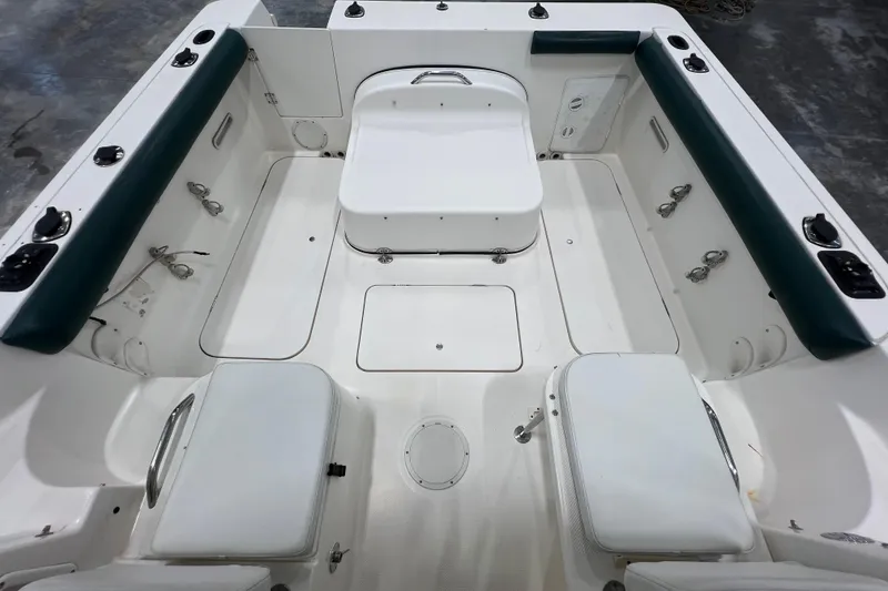 Slide: The Image of 2006 Trophy 2352 WA boat interior with seating and storage compartments. - 14
