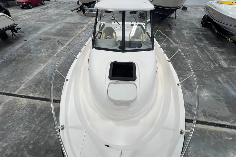 Slide: The Image of 2006 Trophy 2352 WA boat in storage, top view showing deck and cabin. - 17