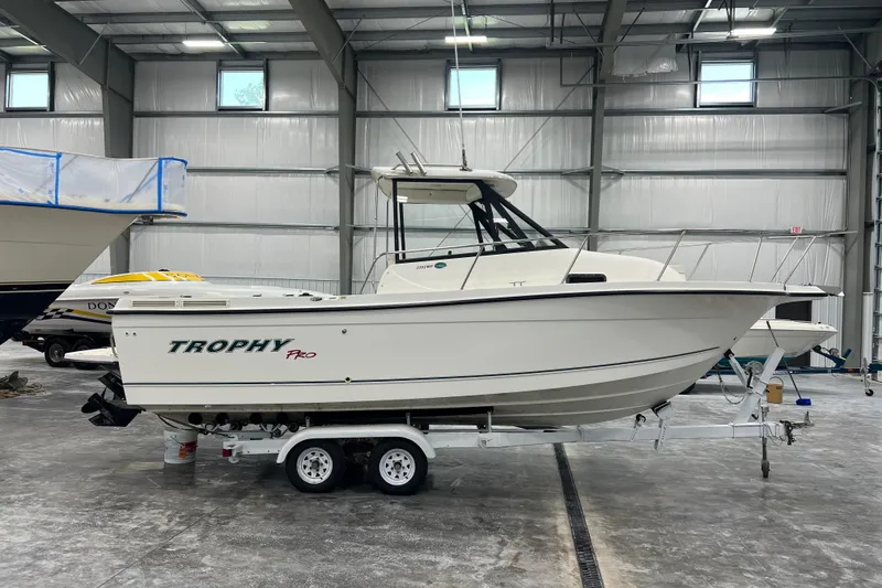 Slide: The Image of 2006 Trophy 2352 WA boat on trailer in indoor storage facility. - 4