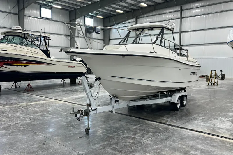 Slide: The Image of 2006 Trophy 2352 WA boat on trailer in indoor storage facility. - 7